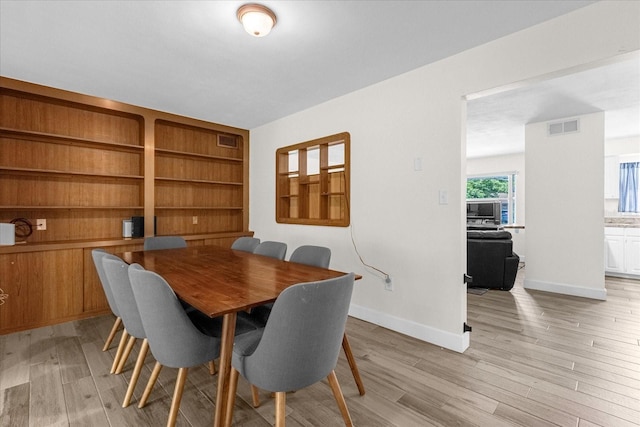 dining room with light wood-type flooring