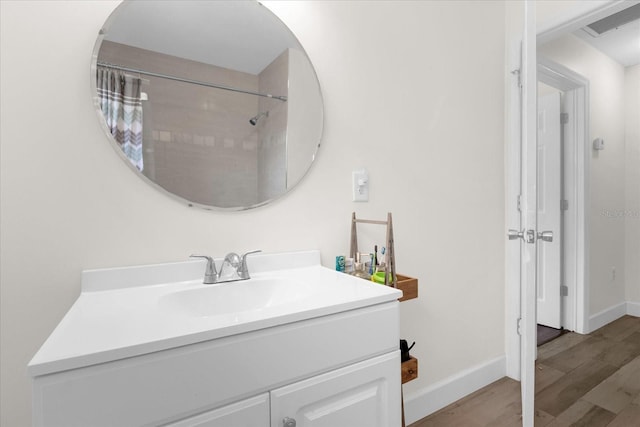 bathroom with vanity and hardwood / wood-style floors