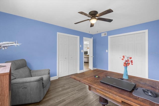 office space featuring hardwood / wood-style flooring and ceiling fan