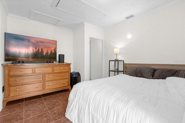 bedroom featuring ornamental molding and dark tile patterned floors