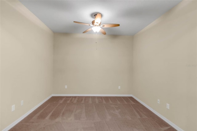 unfurnished room featuring carpet and ceiling fan