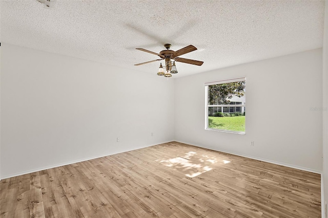 unfurnished room featuring a textured ceiling, light hardwood / wood-style floors, and ceiling fan