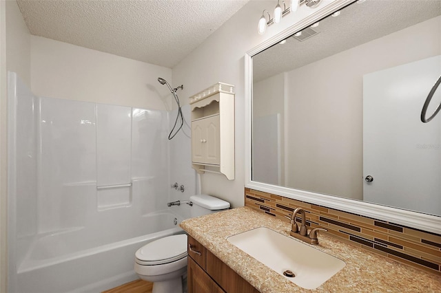 full bathroom featuring decorative backsplash, vanity, a textured ceiling,  shower combination, and toilet