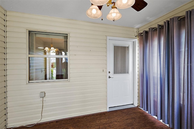 doorway to property featuring ceiling fan