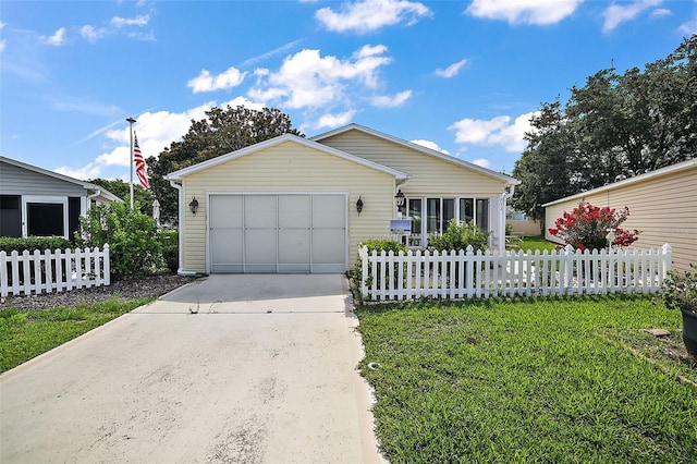 ranch-style home with a front yard and a garage