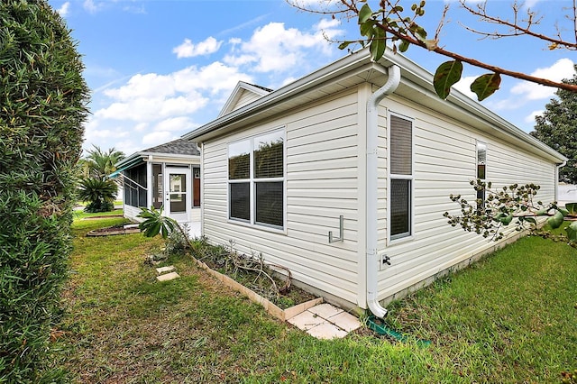 view of home's exterior featuring a lawn