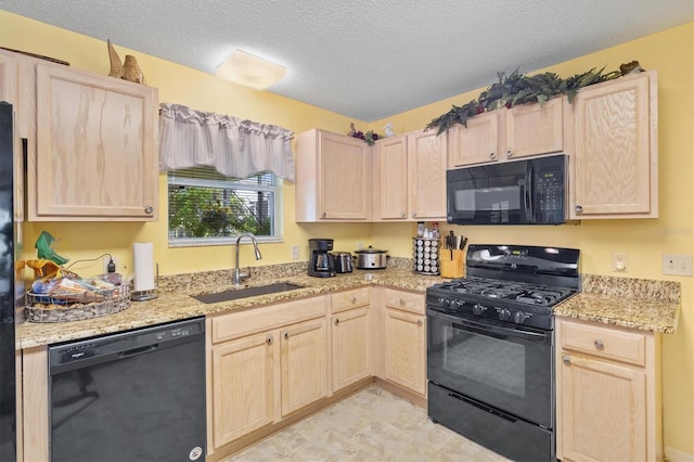 kitchen with sink, black appliances, and light brown cabinets