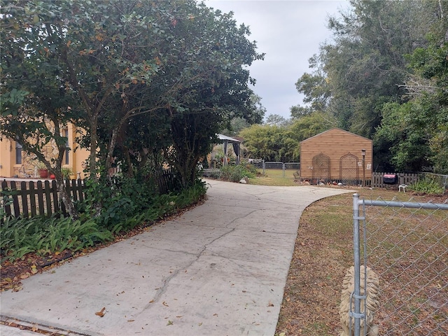 view of street with concrete driveway