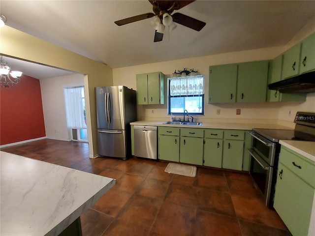 kitchen featuring light countertops, stainless steel appliances, under cabinet range hood, a sink, and green cabinetry