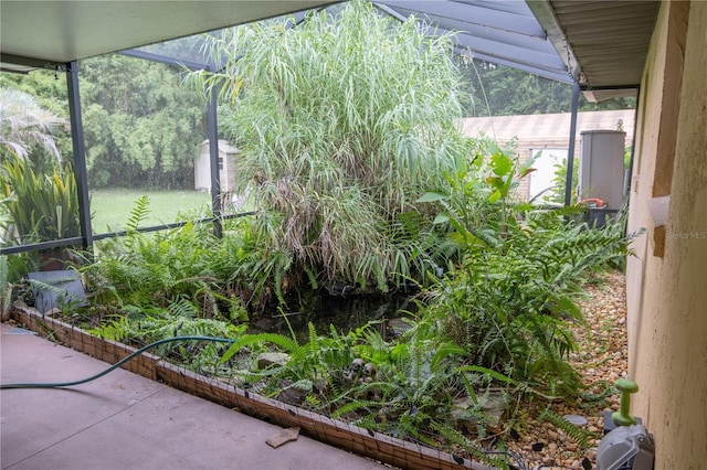 view of yard featuring glass enclosure