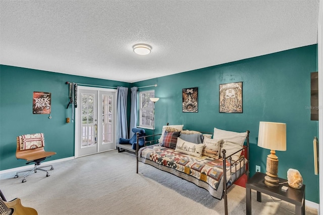 bedroom with access to exterior, baseboards, carpet flooring, and french doors