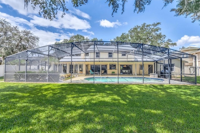 rear view of property featuring a lawn