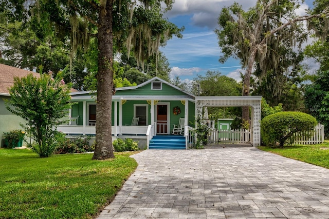 bungalow with a front lawn and a porch