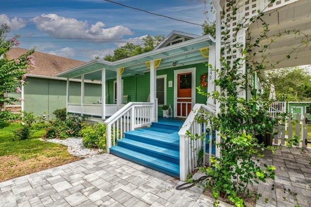 doorway to property featuring a porch