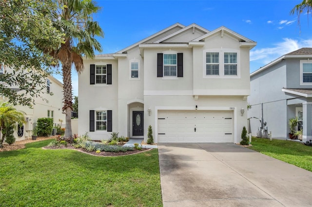 view of front of property featuring a garage and a front yard