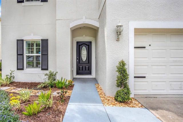 doorway to property featuring a garage