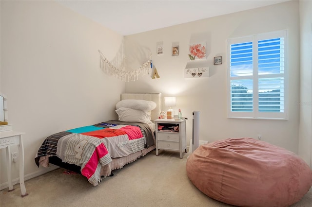 carpeted bedroom with multiple windows