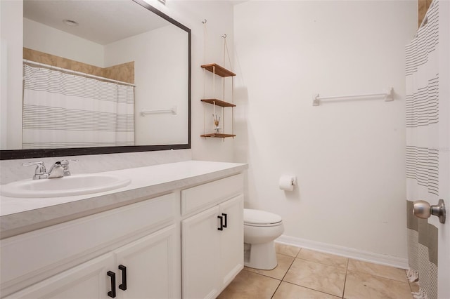 bathroom featuring tile patterned floors, vanity, toilet, and a shower with shower curtain