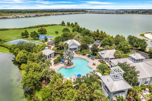 birds eye view of property with a water view