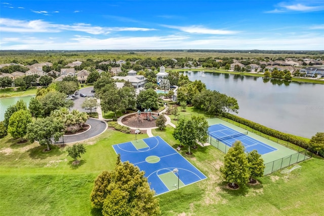 birds eye view of property with a water view