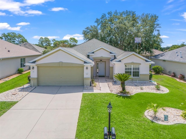 ranch-style house featuring a garage and a front yard