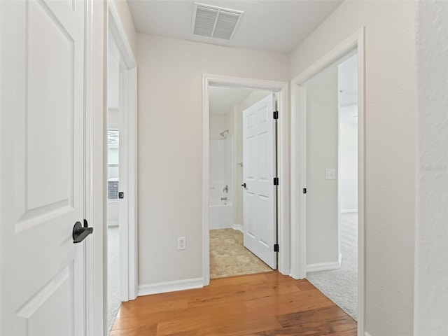 hallway featuring light wood-type flooring