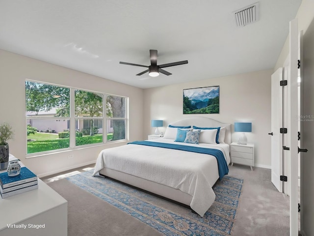 carpeted bedroom featuring ceiling fan