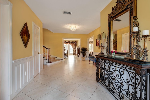 hallway with light tile patterned floors