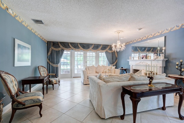 tiled living room with a textured ceiling and a notable chandelier