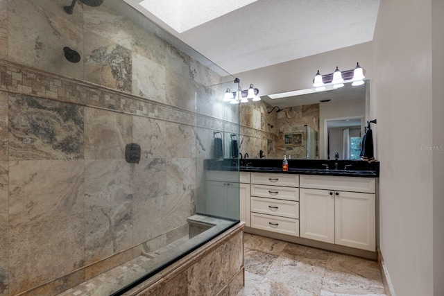 bathroom featuring tile patterned flooring, walk in shower, a textured ceiling, vanity, and tile walls