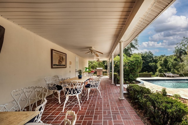 view of patio / terrace with pool water feature and ceiling fan