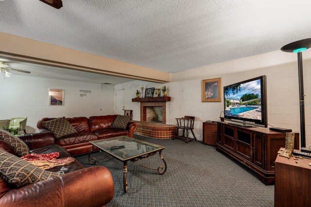 carpeted living room with a textured ceiling, ceiling fan, and a brick fireplace