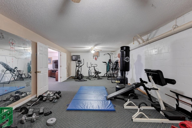 exercise area with a textured ceiling