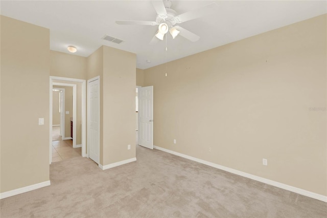 interior space featuring ceiling fan and light carpet