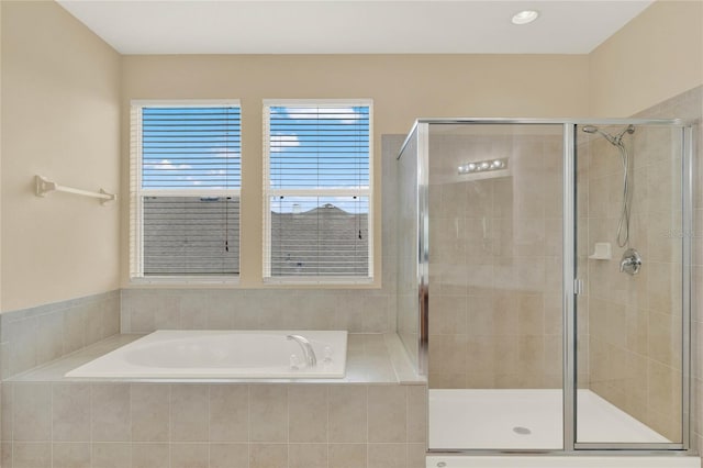 bathroom with shower with separate bathtub