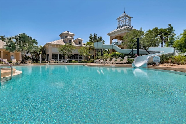 view of swimming pool featuring a water slide