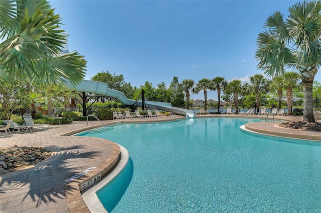 view of pool featuring a water slide