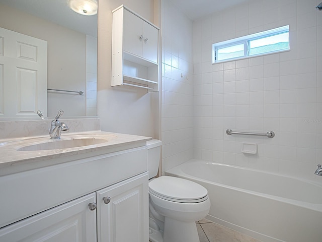 full bathroom with tile patterned floors, vanity, toilet, and tiled shower / bath