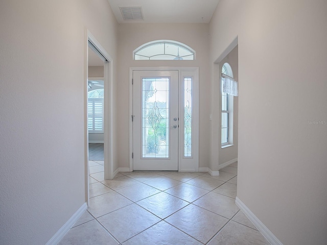 entrance foyer with light tile patterned floors