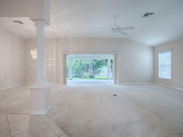 unfurnished living room featuring decorative columns, light carpet, ceiling fan, and lofted ceiling