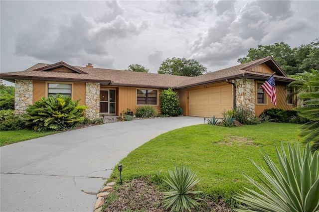 ranch-style house with a garage and a front yard