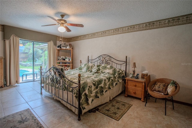 bedroom with a textured ceiling, light tile patterned flooring, a ceiling fan, baseboards, and access to exterior