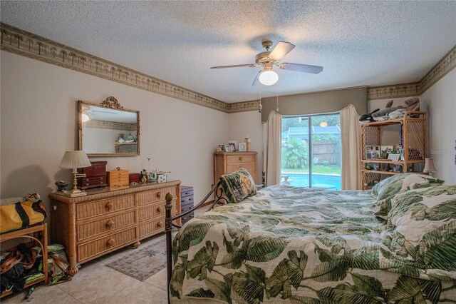 bedroom featuring access to exterior, a textured ceiling, and a ceiling fan