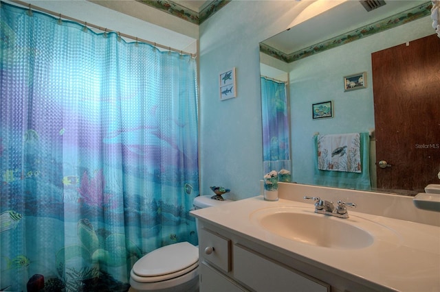 full bathroom with visible vents, vanity, and toilet