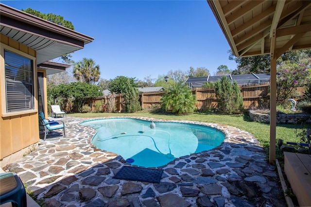 view of pool featuring a fenced backyard, a fenced in pool, and a patio