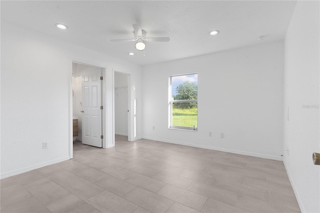 unfurnished room featuring ceiling fan