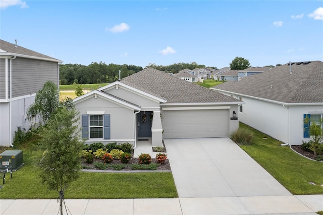 ranch-style house with a garage and a front lawn