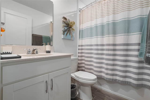 full bathroom featuring shower / bath combo, toilet, and vanity