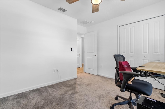 office featuring light carpet and ceiling fan