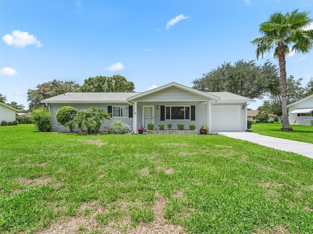 ranch-style house with a front lawn and a garage